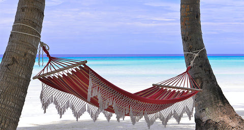 4 Cool LIfestyle Trends This Summer - Red hammock on palm tree beach